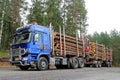 Blue Sisu Polar Timber Truck Hauls Timber